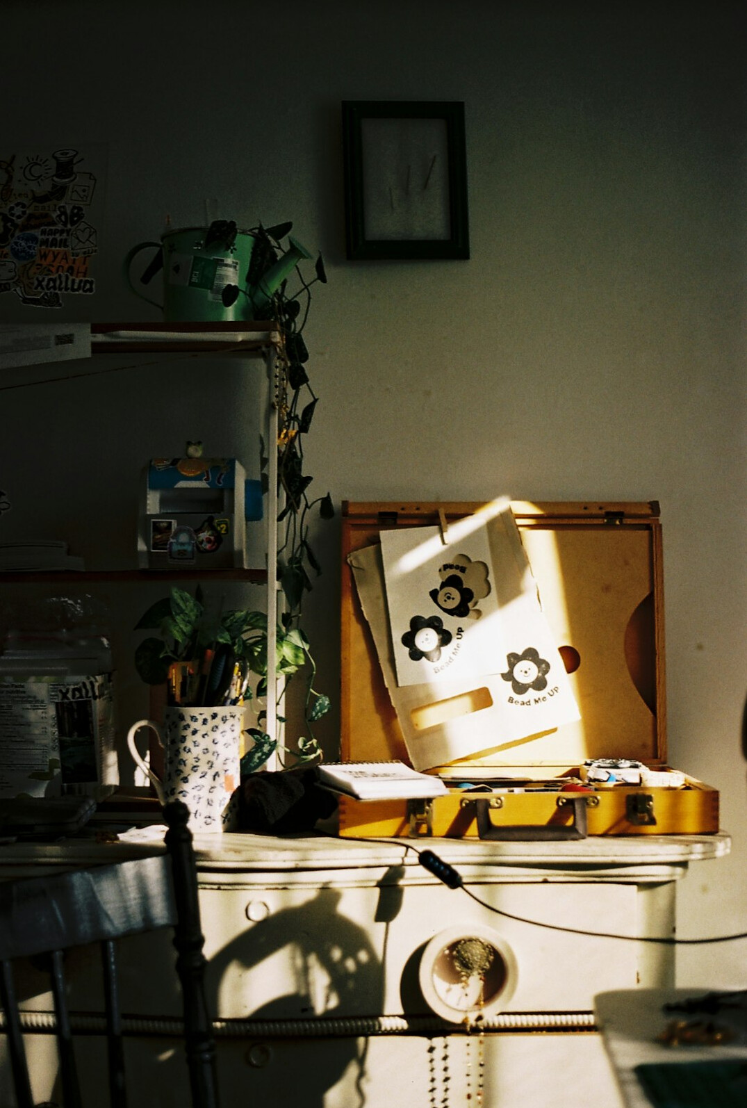 Person working at a desk with a laptop and notebook
